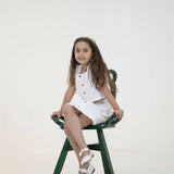 Mamarill Girls Classy Co-Ord Set In Crisp White, Elevated By Stylish Wooden Buttons On The Sleeveless Top.