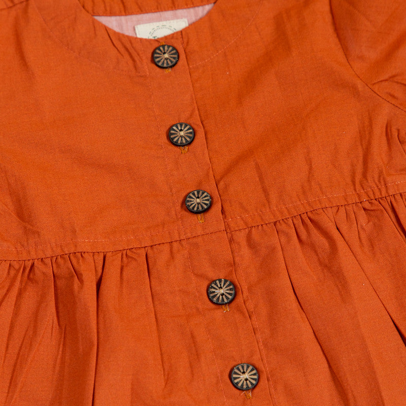 Rust peplum top