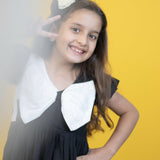 Mamarill Girls Chic Bow Tunic Is A Chic Black Dress With A Distinctive White Bow Accent On The Chest.